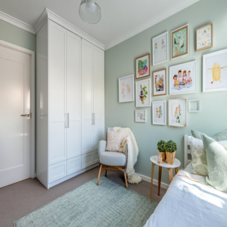 Modern Kids Bedroom Design With Decorated Picture Frame Wall And Glossy Wardrobe